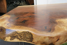 Load image into Gallery viewer,  live edge side or accent table comprised of black walnut slab with hand-forged hairpin legs for a cool mid-century modern look. Slab is hand finished and accented with a single cherry bowtie inlay