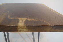 Load image into Gallery viewer, live edge side or accent table, comprising trapezoid shaped black walnut slab and hand-forged steel hairpin legs. Handcrafted for a cool mid century modern look.