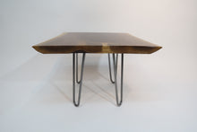 Load image into Gallery viewer, live edge side or accent table, comprising trapezoid shaped black walnut slab and hand-forged steel hairpin legs. Handcrafted for a cool mid century modern look.