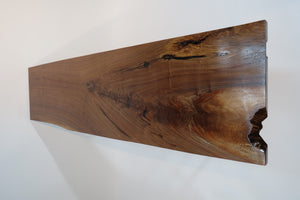 live edge console or hall table, comprising of beautifulhand finished black walnut board atop tall hand-forged hairpin legs for a cool mid-century modern look