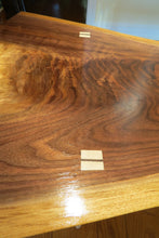 Load image into Gallery viewer, unique hancrafted live edge table in black walnut. Coffee table comprises beautiful crotch slab with white distressed legs that are through-tenoned for a modern look